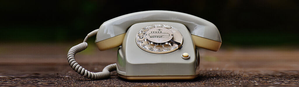 image of an old telephone not equipped for modern on-hold content requirements